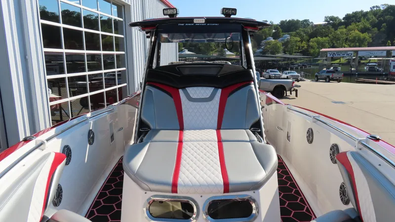 Slide: The Image of 2014 Sunsation 34 CCX boat interior with stylish seating and powerful outboard engines. - 20