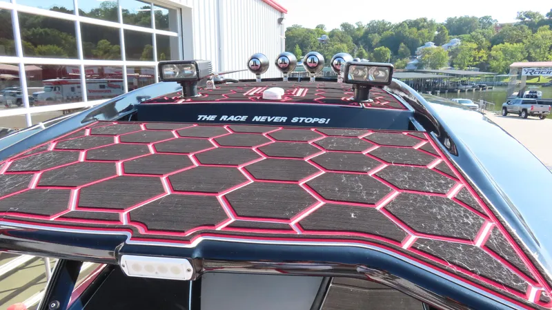 Slide: The Image of 2014 Sunsation 34 CCX boat interior with stylish seating and powerful outboard engines. - 21