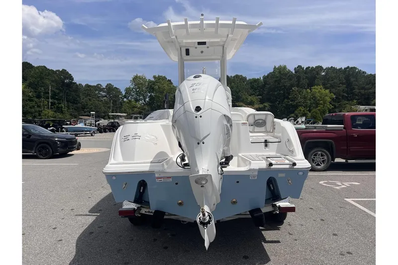 Slide: The Image of 2025 Sea Fox 228 boat, rear view, parked outdoors on a sunny day. - 3