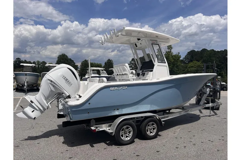 Slide: The Image of 2025 Sea Fox 228 boat on trailer, featuring Yamaha outboard motor, parked outdoors. - 4