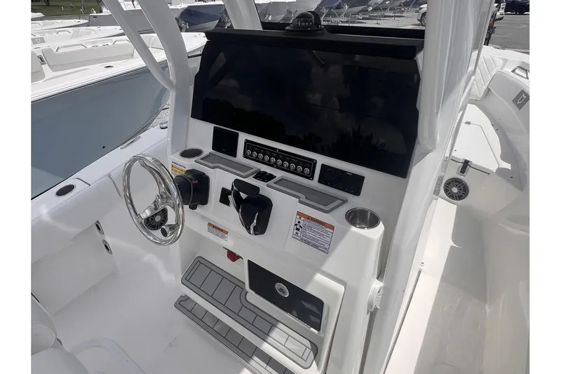 Slide: The Image of 2025 Sea Fox 228 boat dashboard with steering wheel and control panel. - 7