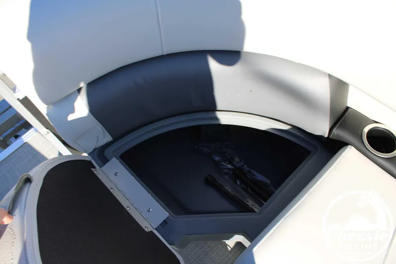 Slide: The Image of 2024 Starcraft Pontoon LX 22 R storage compartment with cup holder and seating. - 11