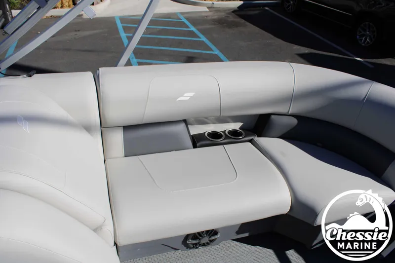 Slide: The Image of 2024 Starcraft Pontoon LX 22 R interior seating with cup holders, Chessie Marine logo. - 17
