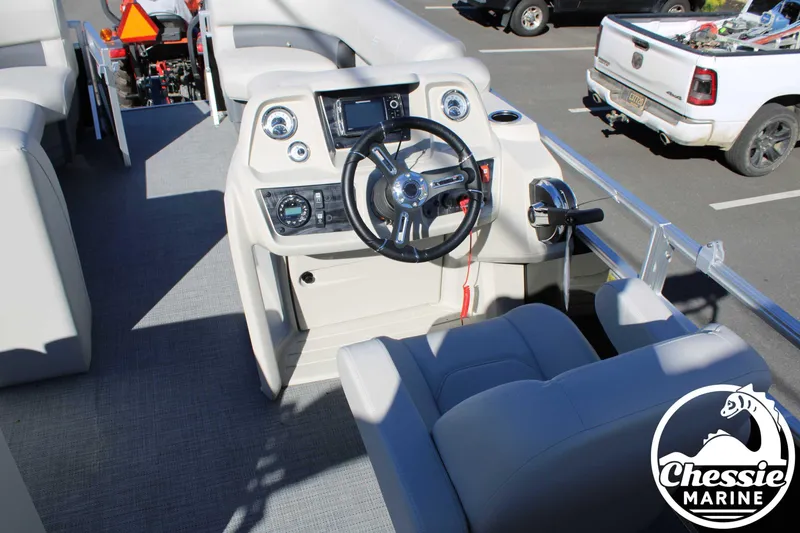 Slide: The Image of 2024 Starcraft Pontoon LX 22 R steering console with modern controls and comfortable seating. - 18