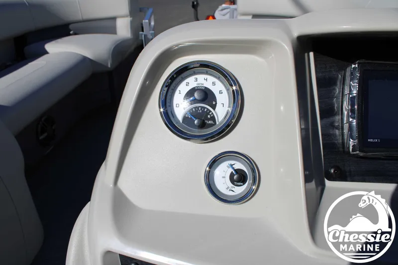 Slide: The Image of 2024 Starcraft Pontoon LX 22 R dashboard with gauges and controls. - 19