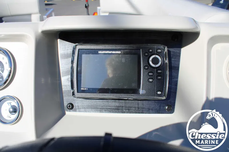 Slide: The Image of 2024 Starcraft Pontoon LX 22 R dashboard with Humminbird Helix 5 display. - 20
