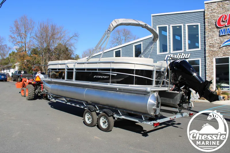Slide: The Image of 2024 Starcraft Pontoon LX 22 R on trailer outside Chessie Marine dealership. - 3