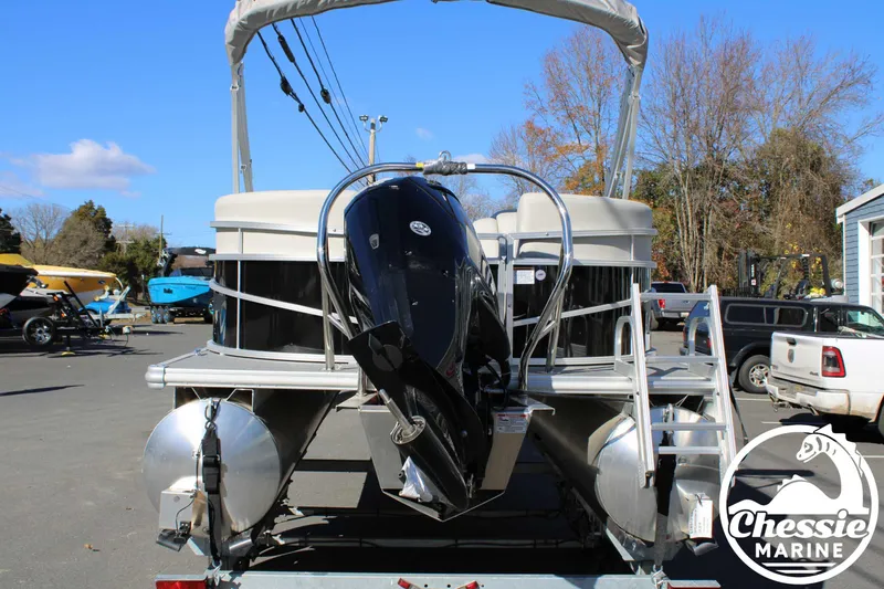 Slide: The Image of 2024 Starcraft Pontoon LX 22 R with outboard motor at Chessie Marine dealership. - 4