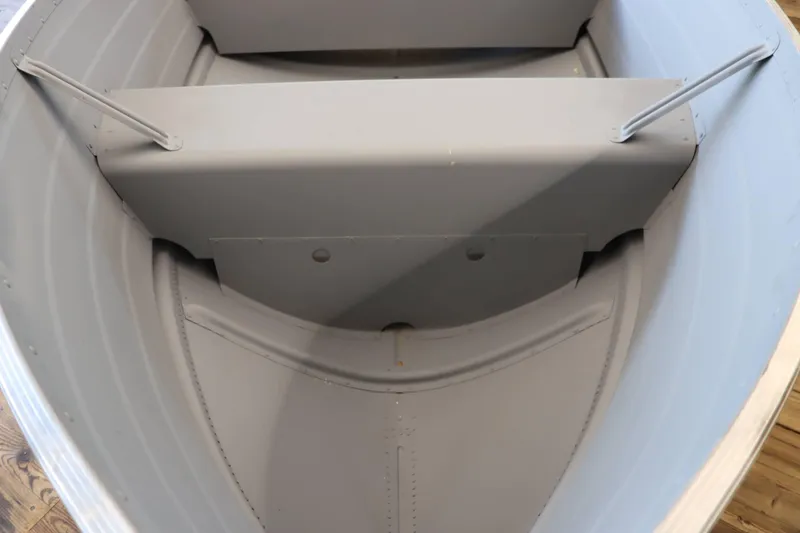 Slide: The Image of Interior view of 2025 Starcraft 14 SF TS SS boat, showcasing seating and structure. - 7