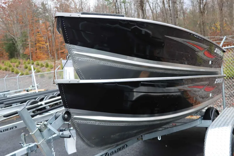 Slide: The Image of 2025 Starcraft 14 SF DLX TL boat on trailer, autumn forest background. - 5