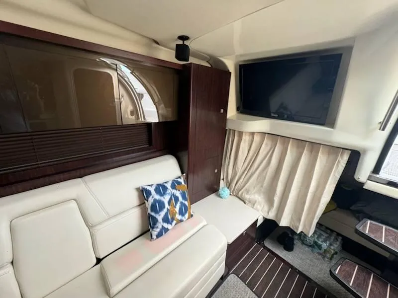 Slide: The Image of Interior of 2016 Monterey 355SY yacht with sofa, TV, and decorative pillow. - 11