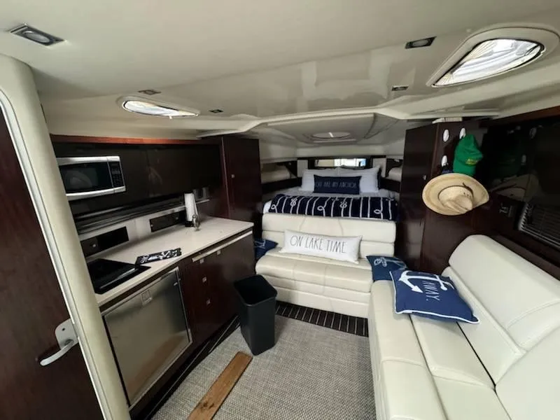 Slide: The Image of Interior of 2016 Monterey 355SY yacht with modern kitchen and cozy seating area. - 12