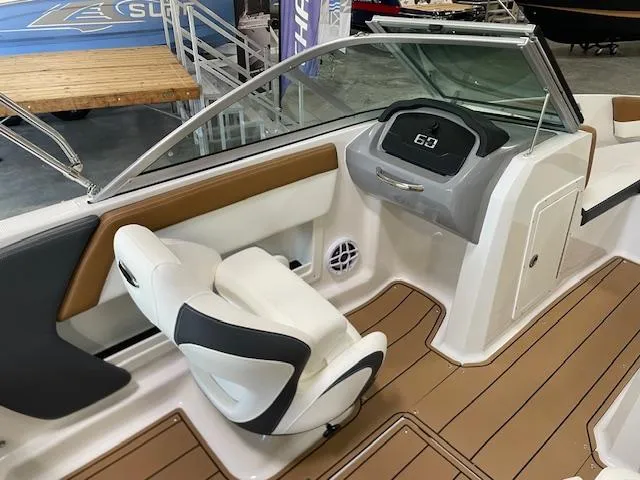 Slide: The Image of 2025 Chaparral 19 SSi OB boat interior with modern dashboard and seating. - 14