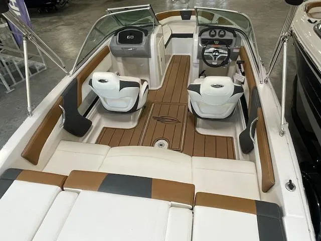 Slide: The Image of 2025 Chaparral 19 SSi OB boat interior with modern seating and dashboard. - 5
