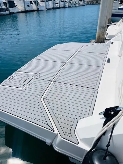 Slide: The Image of 2017 Cruisers Yachts 390 Express Coupe swim platform at marina. - 20