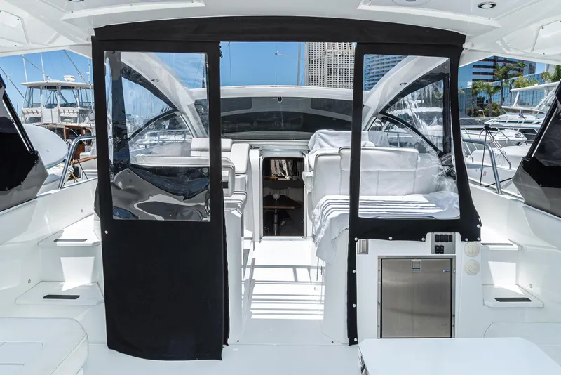 Slide: The Image of 2017 Cruisers Yachts 390 Express Coupe interior with open cockpit and marina view. - 38