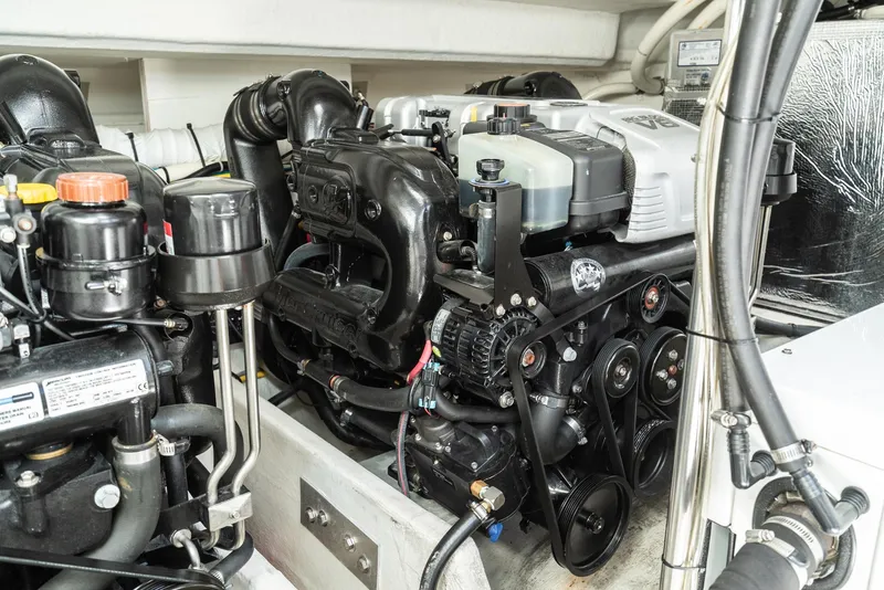 Slide: The Image of Engine compartment of 2017 Cruisers Yachts 390 Express Coupe, showcasing detailed machinery. - 40
