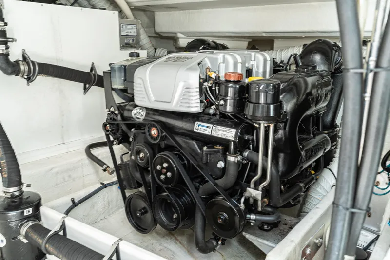 Slide: The Image of Engine compartment of 2017 Cruisers Yachts 390 Express Coupe, showcasing detailed mechanical components. - 41