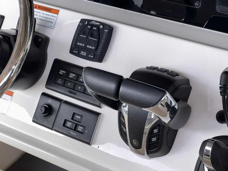 Slide: The Image of Cobia 280 Center Console 2022 boat controls and dashboard with modern features. - 20