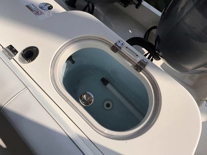 Slide: The Image of Livewell on 2022 Cobia 280 Center Console boat, featuring a sleek design. - 4