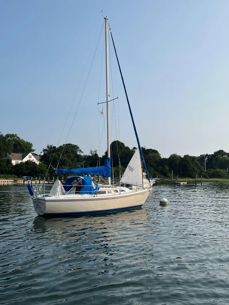 The Image of 1985 Catalina sailboat on calm water with clear sky background. - 1