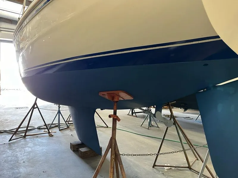 Slide: The Image of 1985 Catalina sailboat in dry dock, showing hull and keel. - 5
