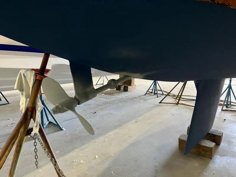 Slide: The Image of 1985 Catalina sailboat propeller and rudder in dry dock. - 7