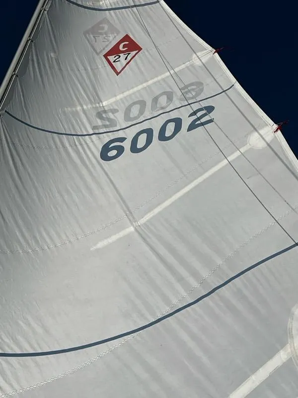 Slide: The Image of Close-up of a 1985 Catalina sailboat sail with number 6002. - 9