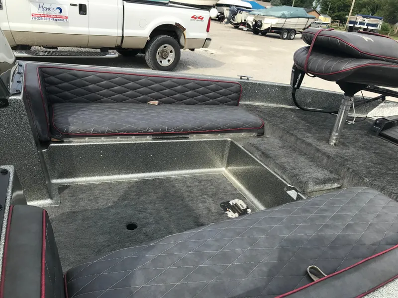 Slide: The Image of 1990 Ranger 375V boat interior with quilted seats and carpeted flooring. - 15