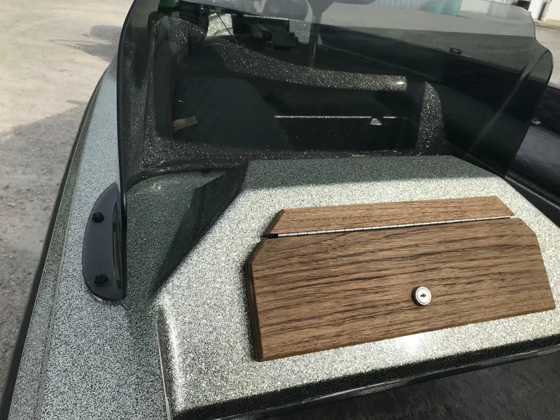 Slide: The Image of 1990 Ranger 375V boat with wood paneling and sleek design. - 23