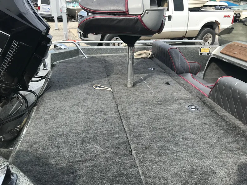 Slide: The Image of 1990 Ranger 375V boat interior with carpeted deck and seating. - 24