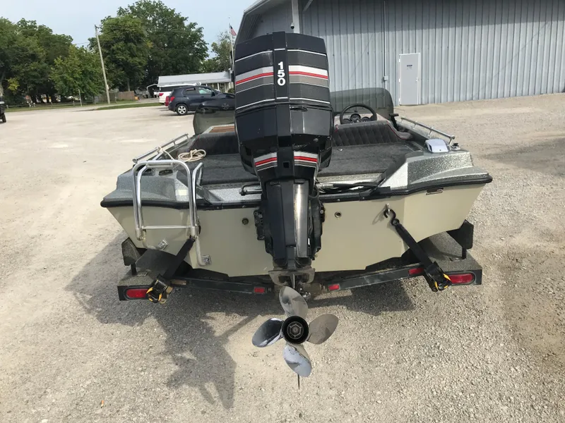 Slide: The Image of 1990 Ranger 375V boat with 150 HP outboard motor on trailer. - 5