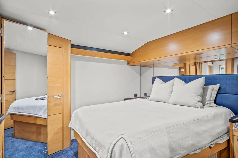 Slide: The Image of Luxurious bedroom interior of 2014 Hatteras 63 GT yacht with modern design. - 48
