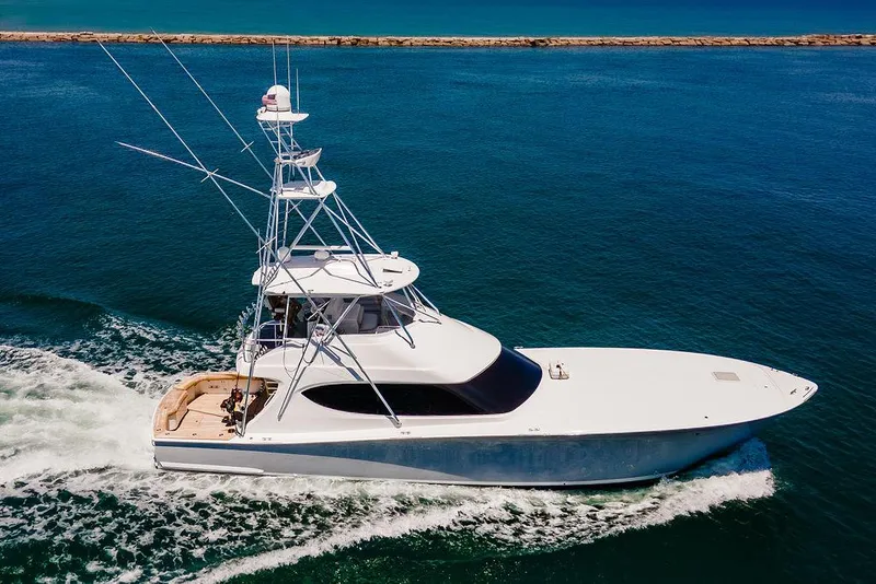 Slide: The Image of 2014 Hatteras 63 GT yacht cruising on open water. - 5