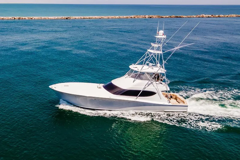 Slide: The Image of 2014 Hatteras 63 GT yacht cruising on open water. - 7