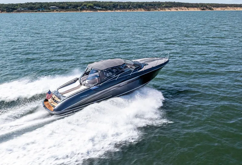 Slide: The Image of 2016 Riva 44 RIVARAMA SUPER luxury yacht cruising on open water. - 0