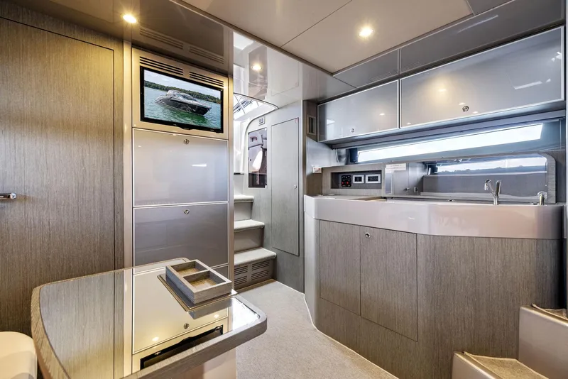 Slide: The Image of Luxurious interior of 2016 Riva 44 RIVARAMA SUPER yacht with modern kitchen and seating area. - 26