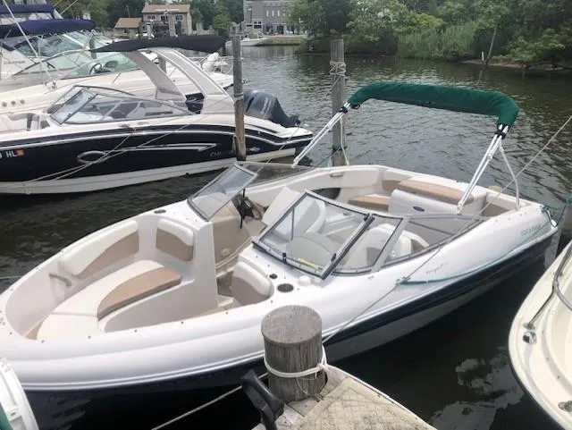 Slide: The Image of 2005 Four Winns 180 Horizon LE boat docked in a marina. - 1