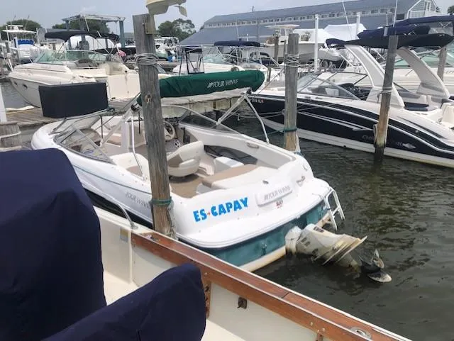 Slide: The Image of 2005 Four Winns 180 Horizon LE boat docked at marina. - 8