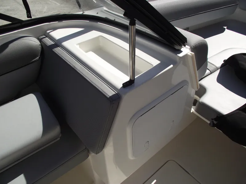 Slide: The Image of 2025 Bayliner D20 boat interior with seating and storage compartment. - 12