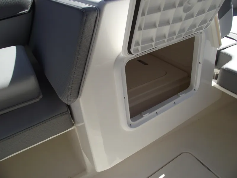 Slide: The Image of 2025 Bayliner D20 boat storage compartment with cushioned seating. - 13