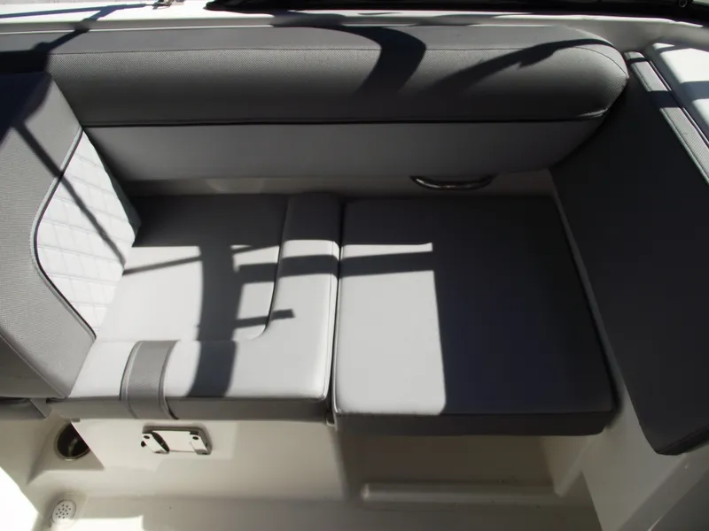Slide: The Image of 2025 Bayliner D20 boat interior seating with gray upholstery and modern design. - 16