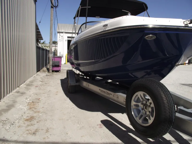 Slide: The Image of 2025 Bayliner D20 boat on trailer. - 2