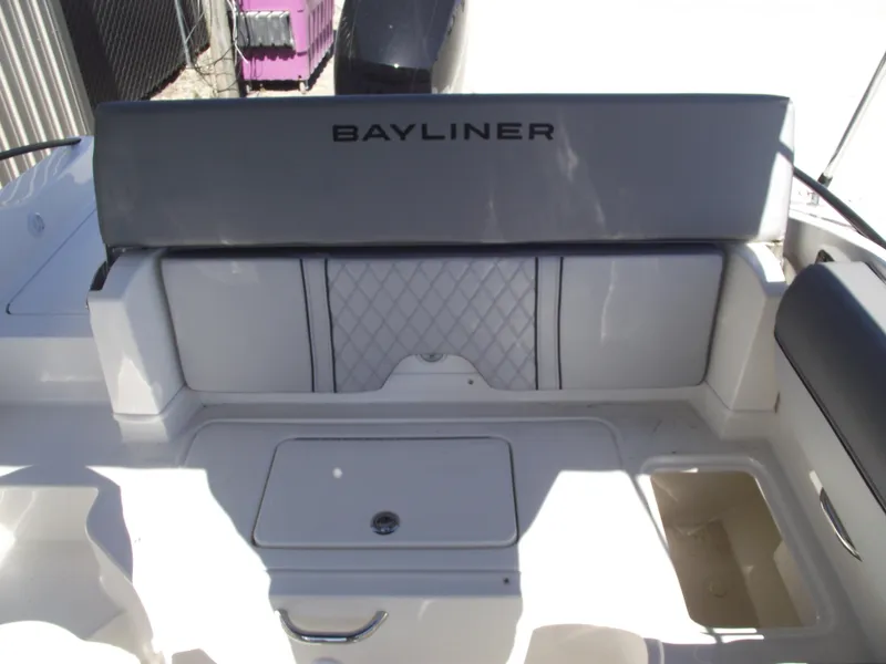 Slide: The Image of 2025 Bayliner D20 boat interior with cushioned seating and storage compartments. - 20