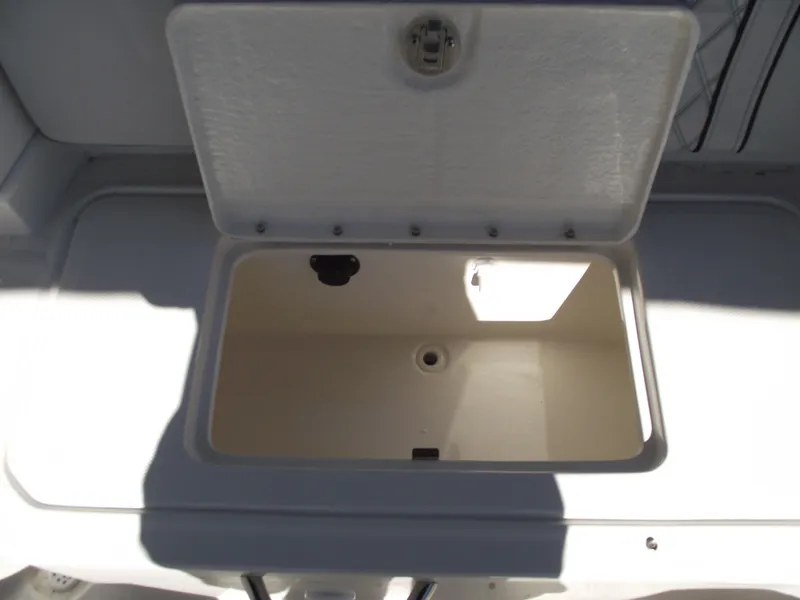 Slide: The Image of Open storage compartment on 2025 Bayliner D20 boat, showcasing interior space. - 21