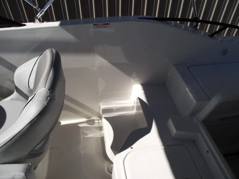 Slide: The Image of 2025 Bayliner D20 boat interior with gray seating and sleek design. - 24