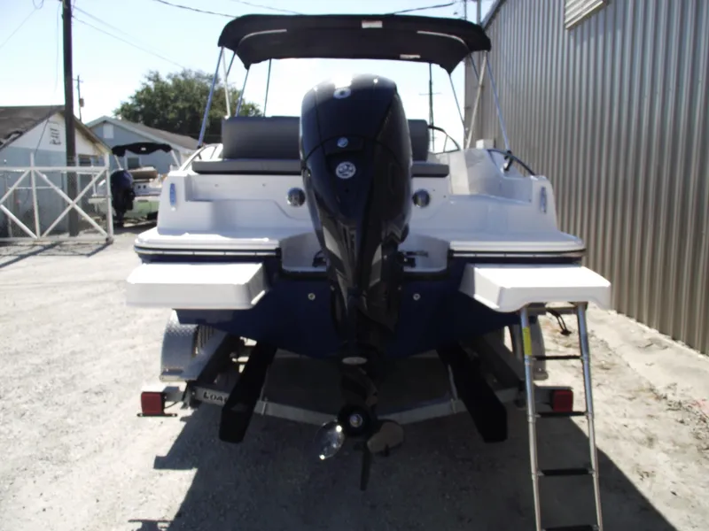 Slide: The Image of 2025 Bayliner D20 boat rear view with outboard motor and ladder. - 3