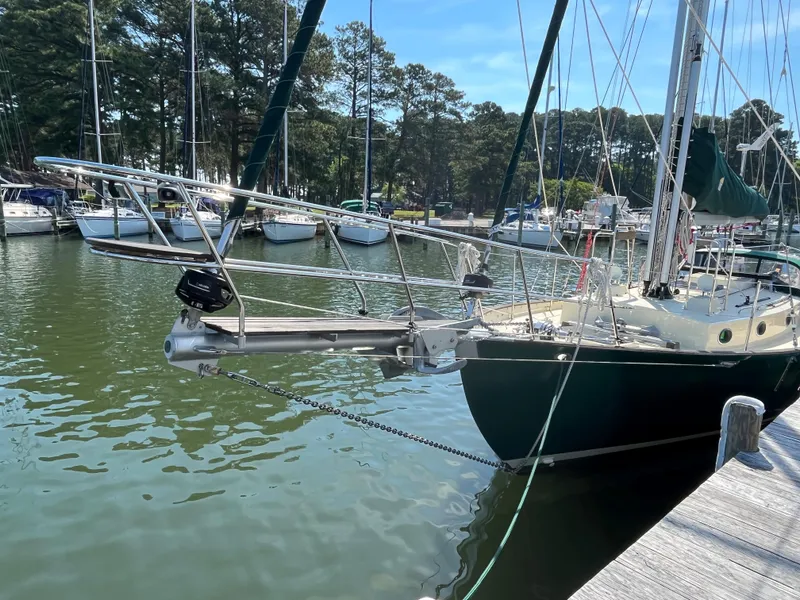 Slide: The Image of Sailboat Alajuela 38, 2016 model, docked in a marina with other boats. - 12