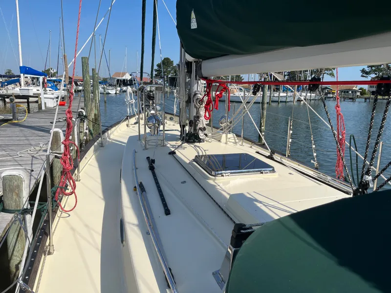 Slide: The Image of Sailboat Alajuela 38, 2016 model, docked at marina with clear blue sky. - 17