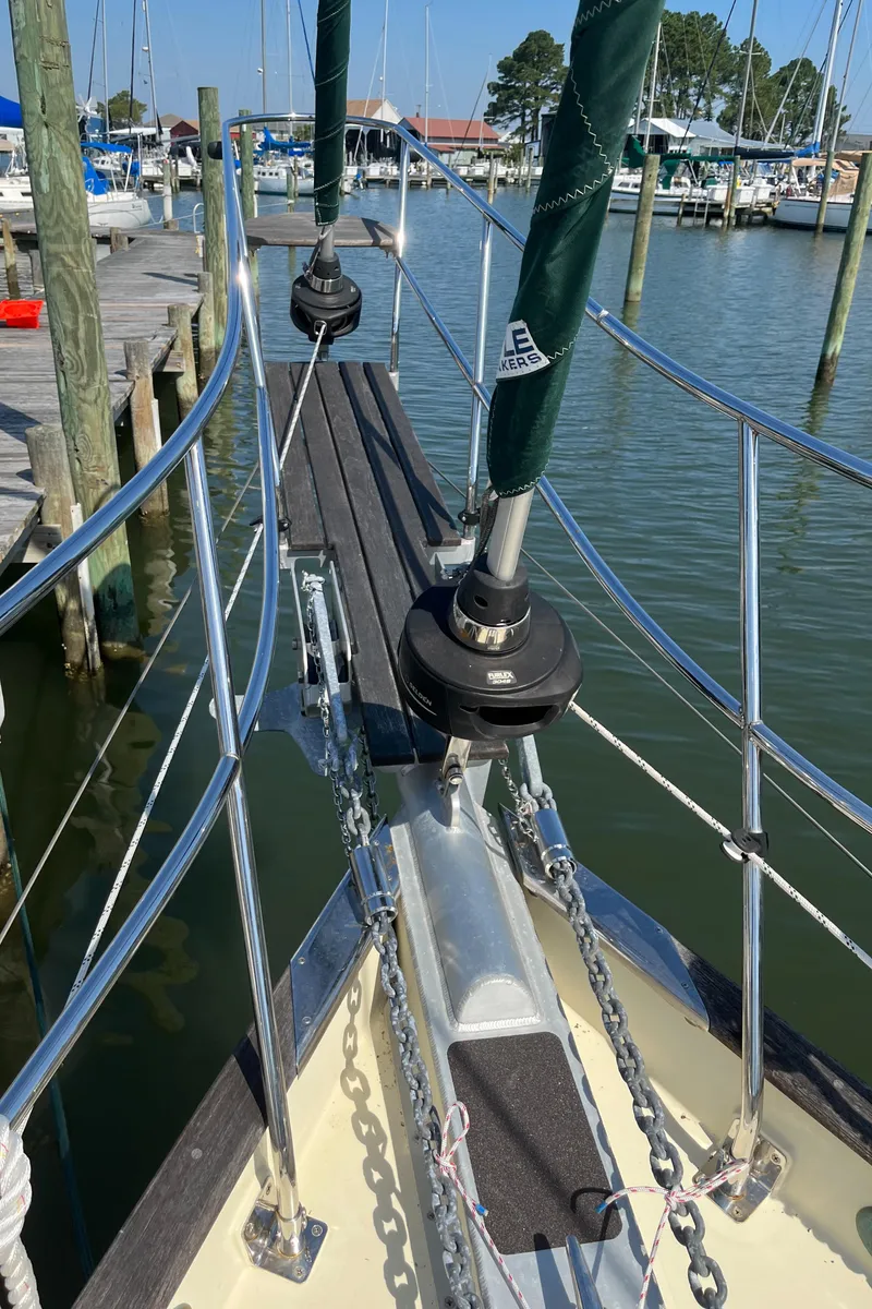 Slide: The Image of Bow of 2016 Alajuela 38 sailboat docked at marina, featuring stainless steel rigging. - 21